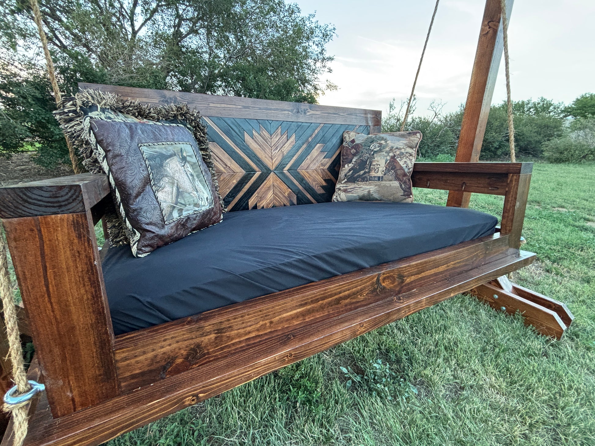 custom handcrafted wood porch swing with freestanding stand dark stain geometric backrest Western outdoor furniture