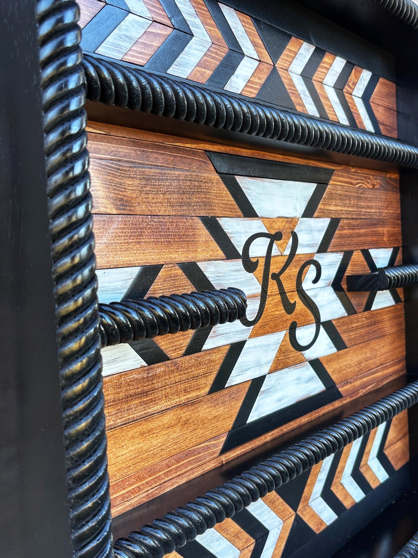 custom Western wood buckle case with name painted in center bold geometric Southwestern design
