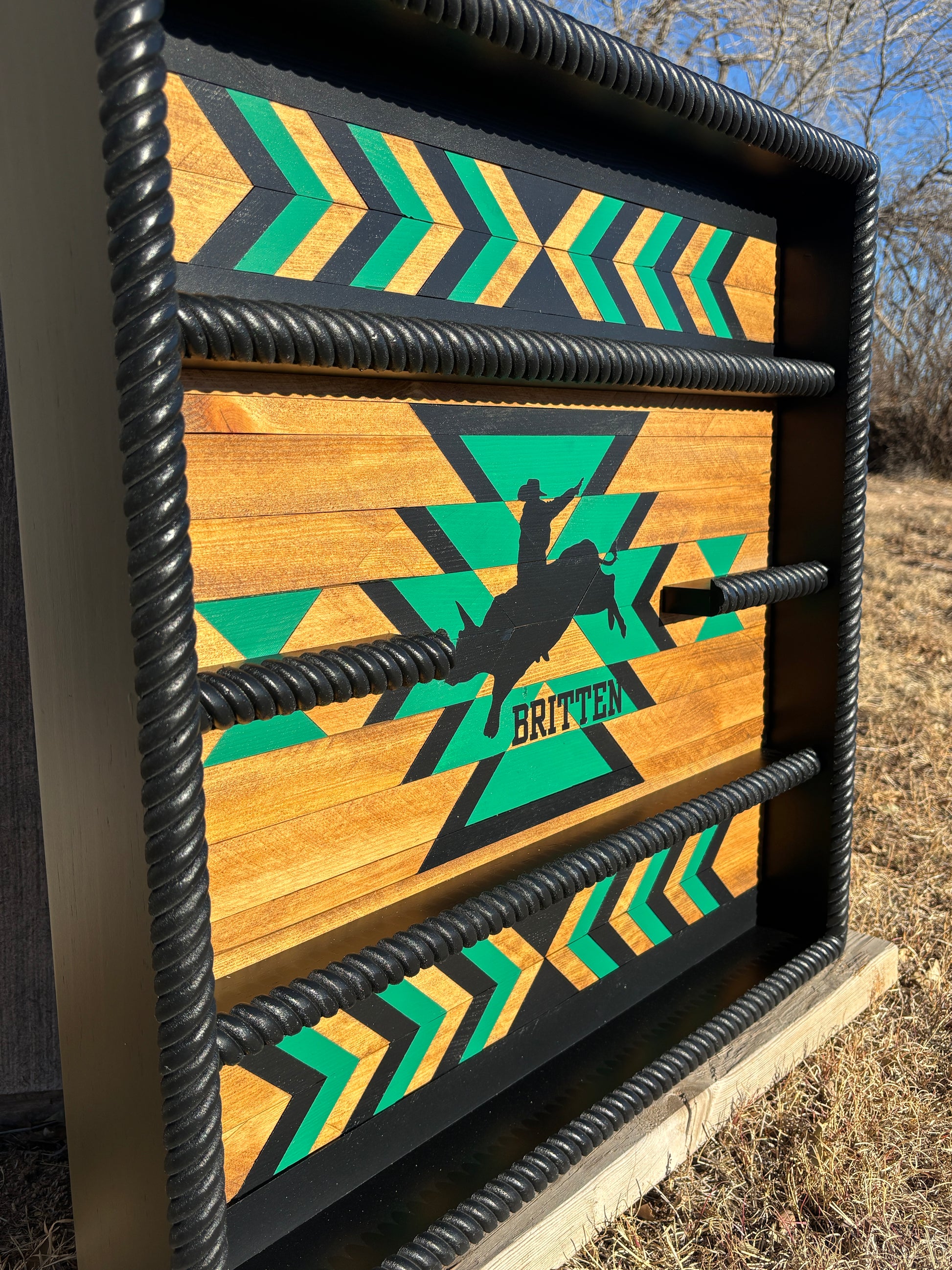custom buckle display case bull rider silhouette painted center geometric design natural wood tones