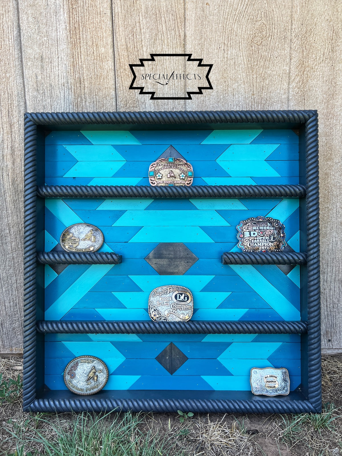 custom handcrafted buckle display case bold blue geometric Aztec design rope rails Western decor